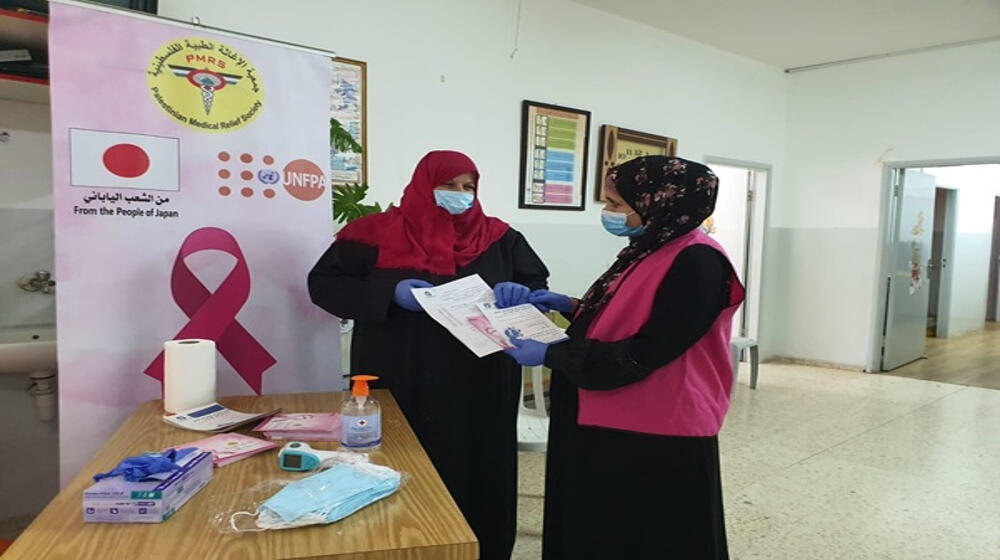 In a clinic distributing leaflets to beneficiaries ©UNFPA Palestine